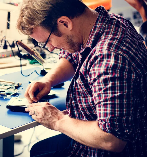 technicians-working-on-computer-hard-disk-2026-03-18-09-56-07-utc-69e0d2309d45f